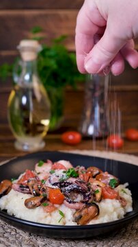 Sprinkling Parmesan on Seafood Risotto Vertical Video