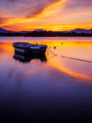 Fototapeta premium Fishermen''s boats in a bay in the sunset