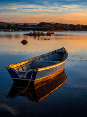 Fototapeta premium Fishermen''s boats in a bay in the sunset