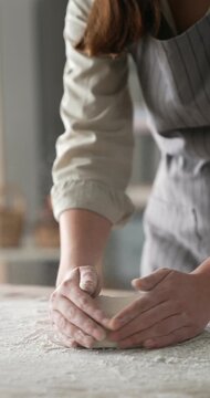 Kneading dough at the kitchen table