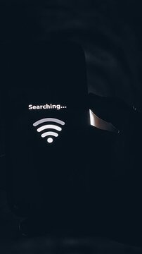 Vertical video. Smartphone Searching for Wireless Signal Inside Dark Underground Tunnel, Cinematic Isolation Scene About Lost Connection and Communication Failure