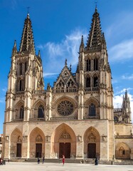 Fototapeta premium Grand cathedral with ornate architecture against a bright blue sky