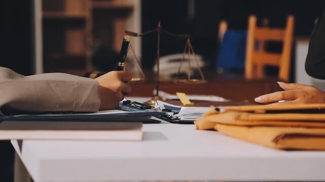 Lawyer explained to the client about the law that must be brought against the court case.