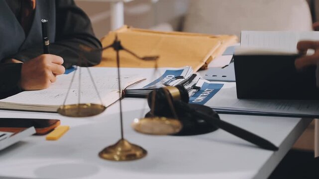 Lawyer explained to the client about the law that must be brought against the court case.