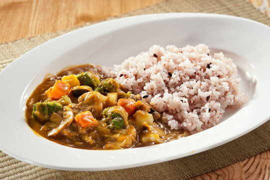 Japanese Vegetable Curry Rice, Savory Mild Curry Sauce with Multigrain Rice on White Plate