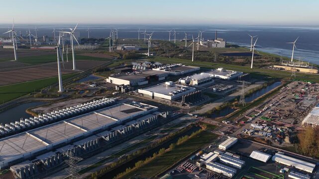Aerial drone view of the Eemshaven datacenter complex and hyperscale expansion for big data, cloud computing, and machine learning infrastructure.