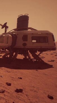 A lander sits on the surface of Mars surrounded by rocks and dust. The skies show an orange hue as the sun shines down on the spacecraft. This scene represents space exploration and discovery.