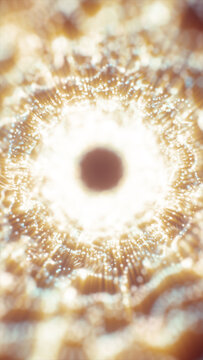 Abstract golden particle ring with bright glowing dots and circular energy waves in a soft luminous background.