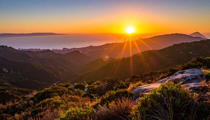 Obraz premium A breathtaking sunset over a mountain range with vibrant colors
