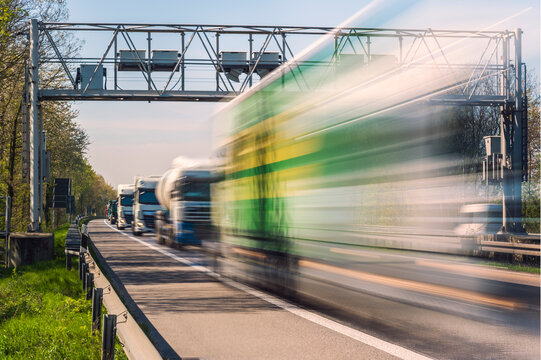 Germany, Grevenbroich, Lorries and toll bridge