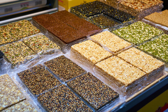 Traditional Korean Gangjeong sweets made of seeds and sesame at a market in South Korea.