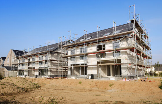 Germany, North Rhine-Westphalia, Neuss, view to construction site of two semidetached houses