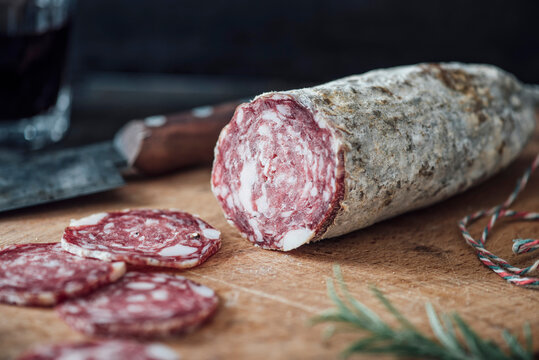 Sliced salami on cutting board