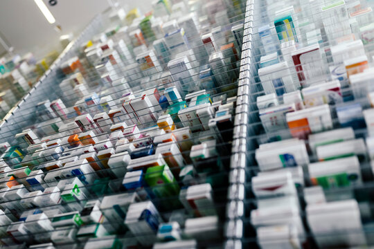 Medicine in shelves in commissioning machine in pharmacy