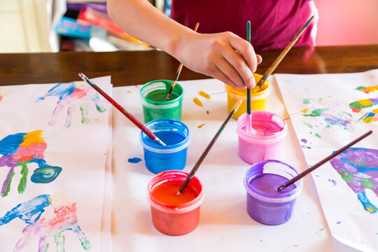 Girl playing with finger paint