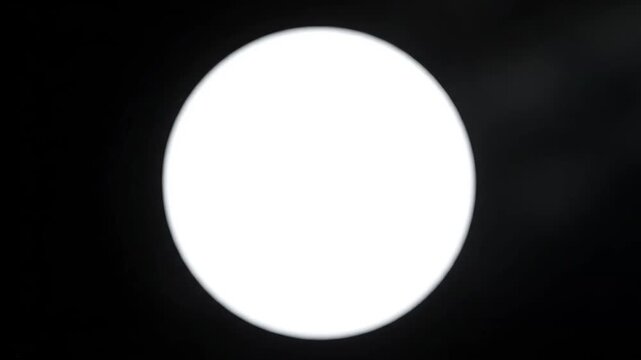 Bright white circle against black background ideal for creative backgrounds and modern web design