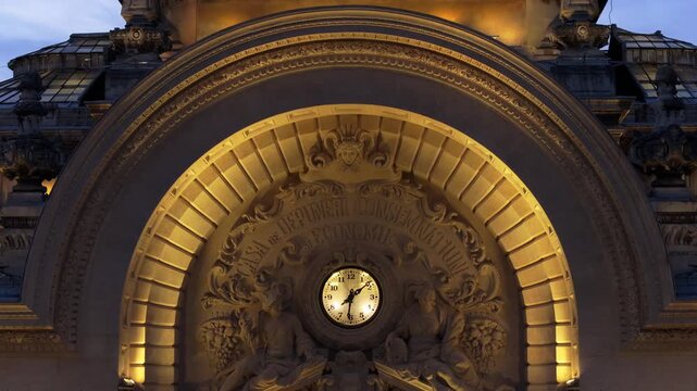 Architectural detail of historic cec palace building facade in bucharest at twilight.