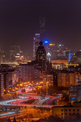 Obraz premium Beijing skyline at night, cityscape of skyscrapers, traffic lights and light trails