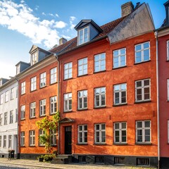 Fototapeta premium Historic buildings with colorful facades under a clear blue sky
