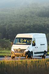 White service van making timely deliveries © AlexGo