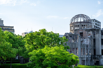 Atomic Bomb Dome Against Blue Sky with Green Trees and Copy Space © 亀山 篠介