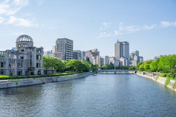 Atomic Bomb Dome Against Blue Sky with Green Trees and Copy Space © 亀山 篠介