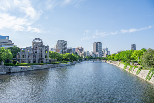 Atomic Bomb Dome Against Blue Sky with Green Trees and Copy Space