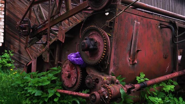 old retro red agricultural harvester for combine harvester for threshing wheat barley and soybeans in summer and autumn