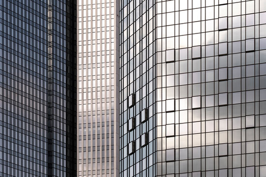 Silver towers in Frankfurt, Germany turn modern urban architecture into a quiet study of building facade, glass reflection and grid geometry