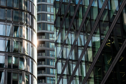 Curved towers and angled glass meet in Frankfurt, Germany, where modern urban architecture builds reflection, facade rhythm and geometry