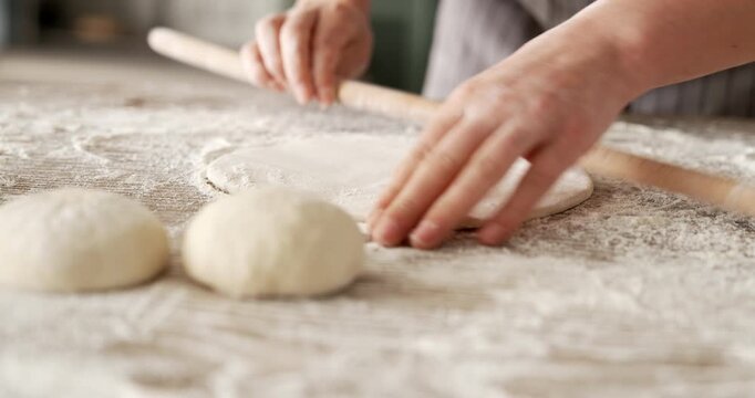 Kneading dough at the kitchen table