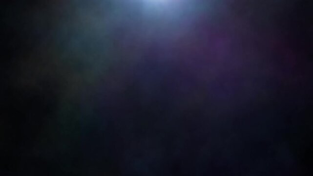 Vibrant purple and blue smoke swirling in the dark, loopable atmospheric abstract motion graphic