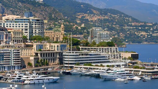 Panoramic view of Port Hercules luxury yachts and cityscape in Monaco.