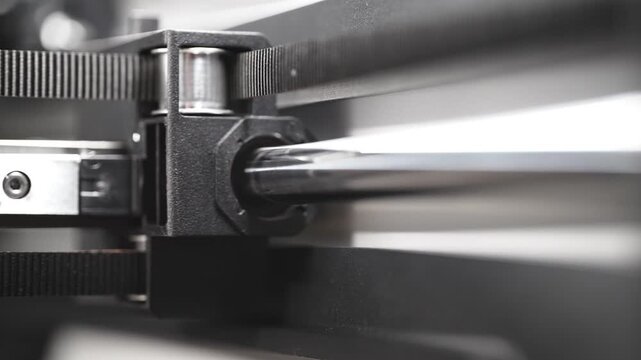 3D printer timing belt moving inner carriage along a polished metal rod