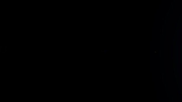 Bright cinematic lens flare animation on black background. Ideal for drag and drop video editing, logo reveals, trailers, intros and visual effects projects in seamless 4K.