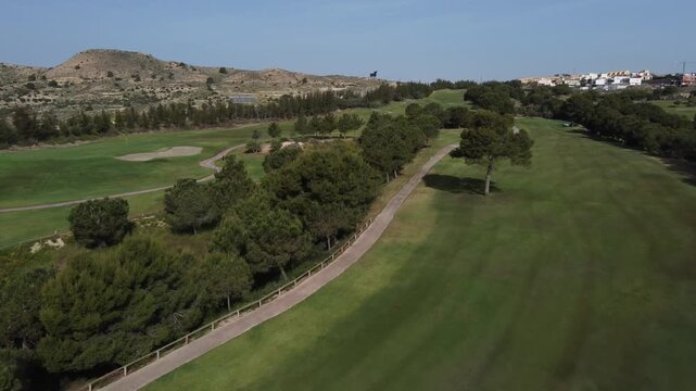 Flying over a golf course with the Osborne bull sign in the background. Alenda golf course, Monforte del Cid, Spain.