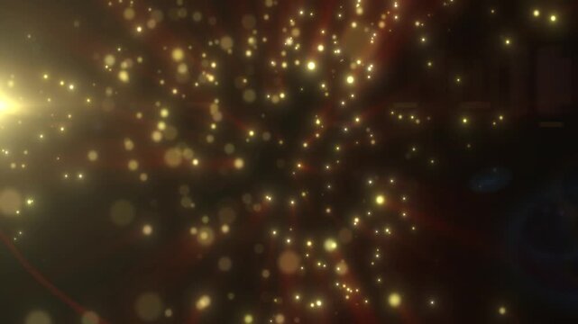 Golden glowing particles floating in dark space with warm red tones, soft bokeh, and dramatic light burst
