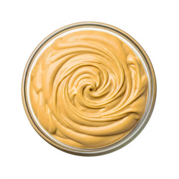 Dulce de leche swirl in glass bowl isolated on transparent background