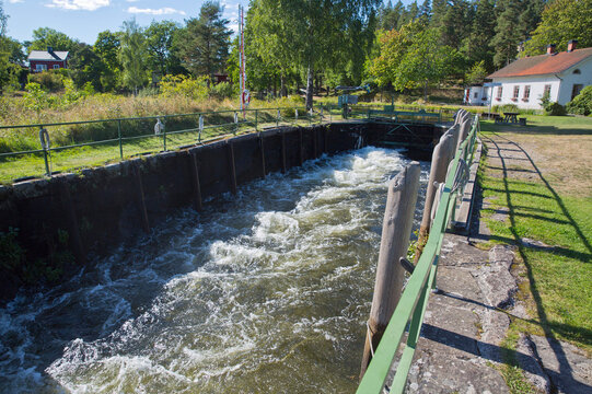 Water flowing in canal at rural area on sunny day