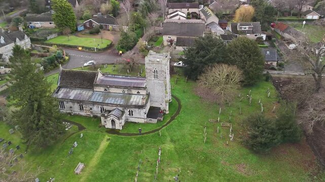 Aerial Side View of St John the Baptist Church in Cranford Village Northamptonshire England