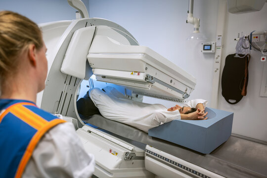 Patient undergoing through X-ray scan at clinic