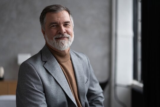 Portrait of a confident mature businessman near the window.