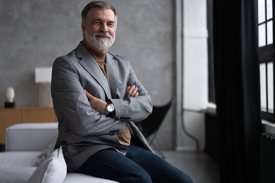 Portrait of a confident mature businessman near the window.