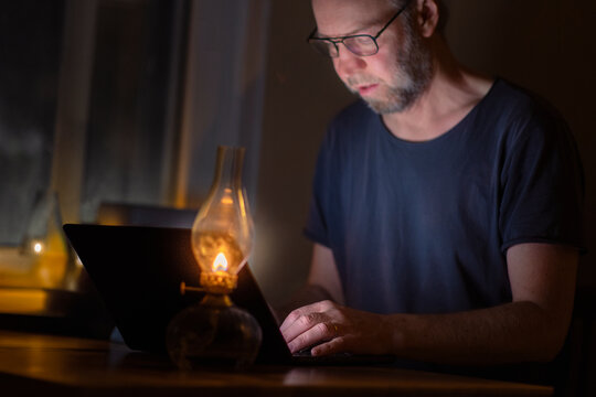 Male freelancer working late while sitting at home