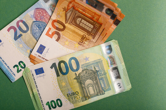 A collection of euro banknotes including 20, 50, and 100 euro denominations.