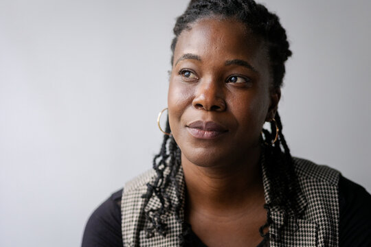 Headshot of contemplative female entrepreneur looking away