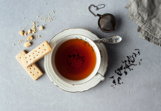 Directly above view of black tea served with buttery shortbread cookies