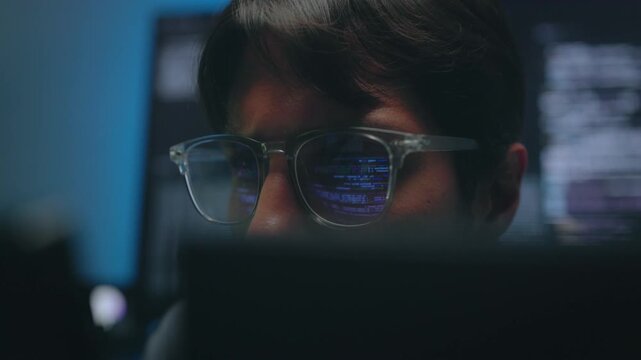 Software Engineer Face Glow with Digital Code Reflection on Spectacles