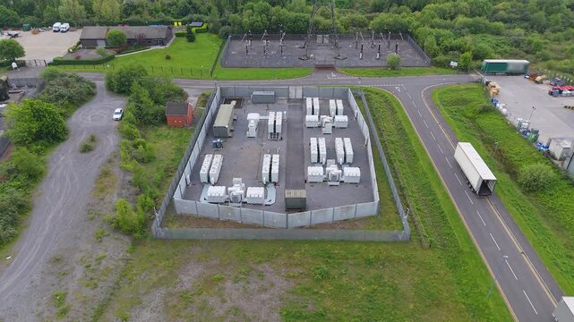 Aerial of BESS Battery Energy Storage System installation made of lithium-ion. Modern green energy infrastructure, smart grid technology, energy transition, sustainable power solutions. UK.