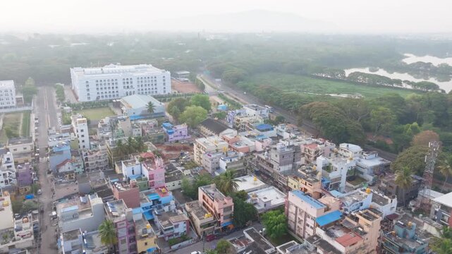 Residential buildings with Maharani's Women's Commerce Management College, hunsur road and Kukkarahalli Lake at Mysuru, karnataka, india. day time, push in shot, drone shot, 4k.